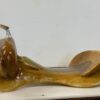 A wooden spoon sitting on top of a table.