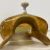A close up of the top of a banana peel with a white background