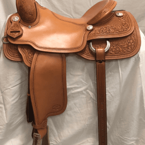 A saddle that is sitting on the ground.