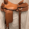 A saddle is hanging on the wall